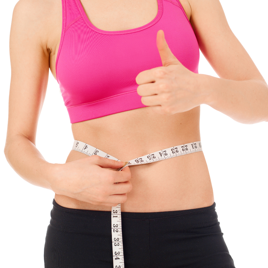 A woman in a pink sports bra measuring her waist with a tape measure, giving a thumbs-up gesture.