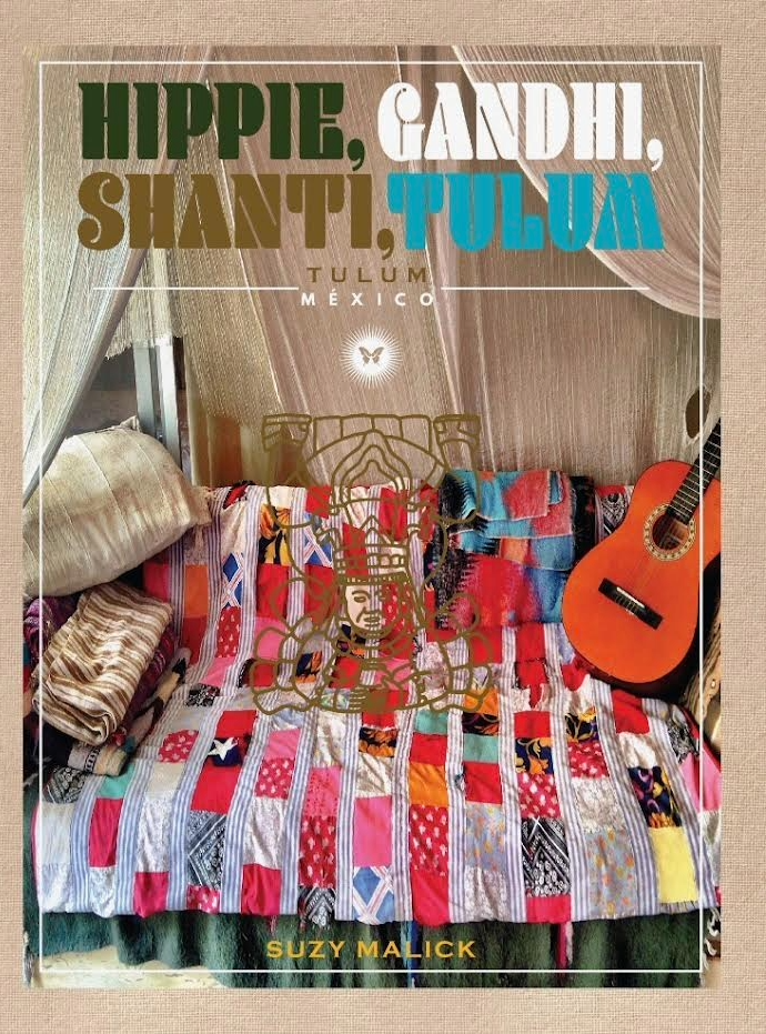 Book cover titled 'Hippie, Gandhi, Shanti, Tulum' by Suzy Malick, featuring a colorful 1960's original patchwork quilt, a guitar, pillows, and a decorative Mayan glyph in a cozy, bohemian-style setting in Tulum, Mexico.