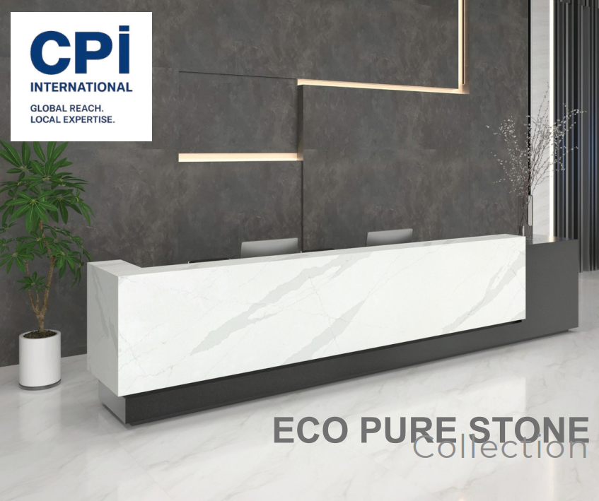 Modern reception desk made of white marble with gray veining, situated in a sleek, contemporary office lobby with a dark textured wall, a potted plant, and decorative light fixtures.