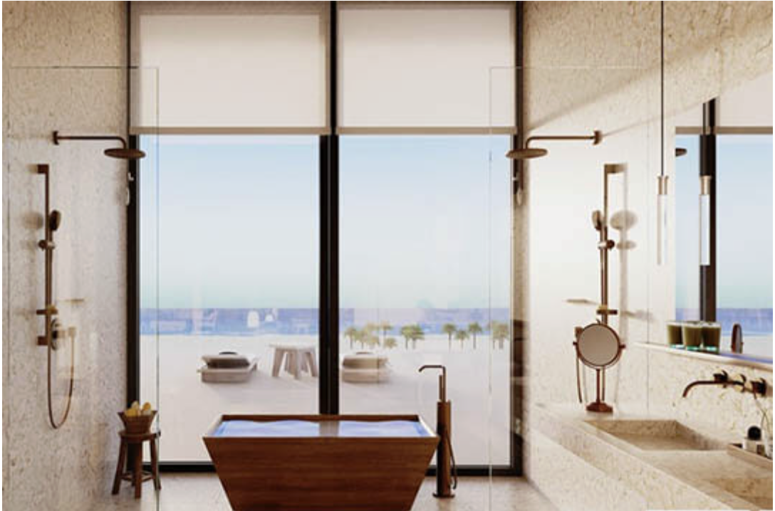 Modern bathroom with a freestanding bathtub, glass sliding door leading to a balcony with outdoor seating, and ocean view