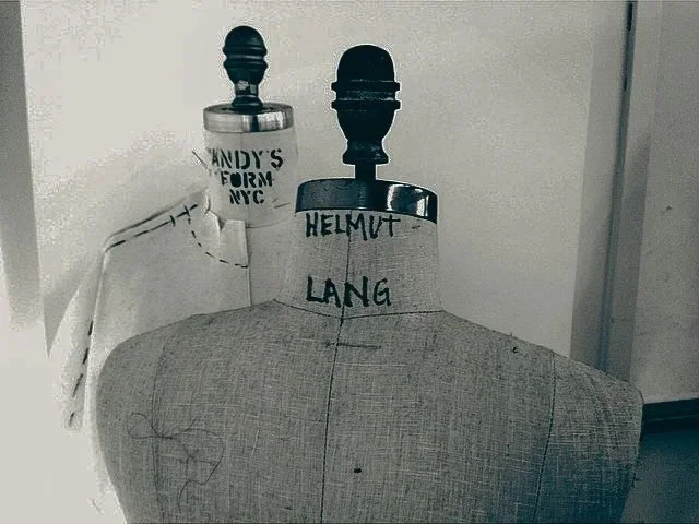 Two dress forms with handwritten labels, one marked "Helmut Lang" and the other labeled "Randy's Form NYC."