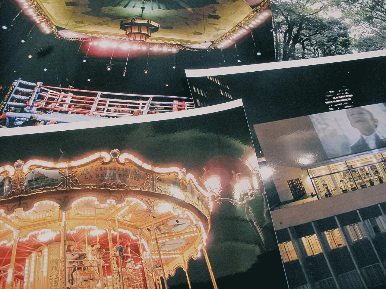 A collage of five different images including a boxing ring, a carousel, a large outdoor screen with a man's face, a forest with trees, and a modern building with windows.