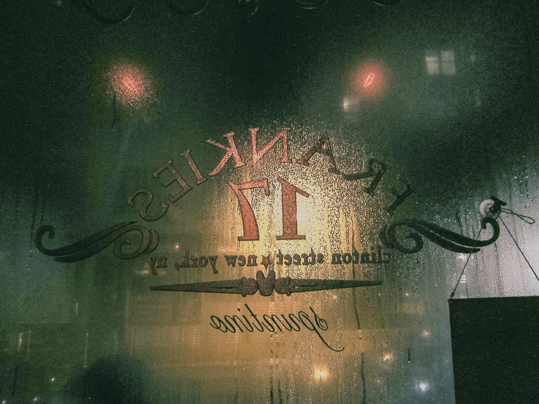 A rain-covered window with a logo that reads 'PRAIRIE'S' and 'since 1924' along with the phrase 'delicious' written at the bottom.