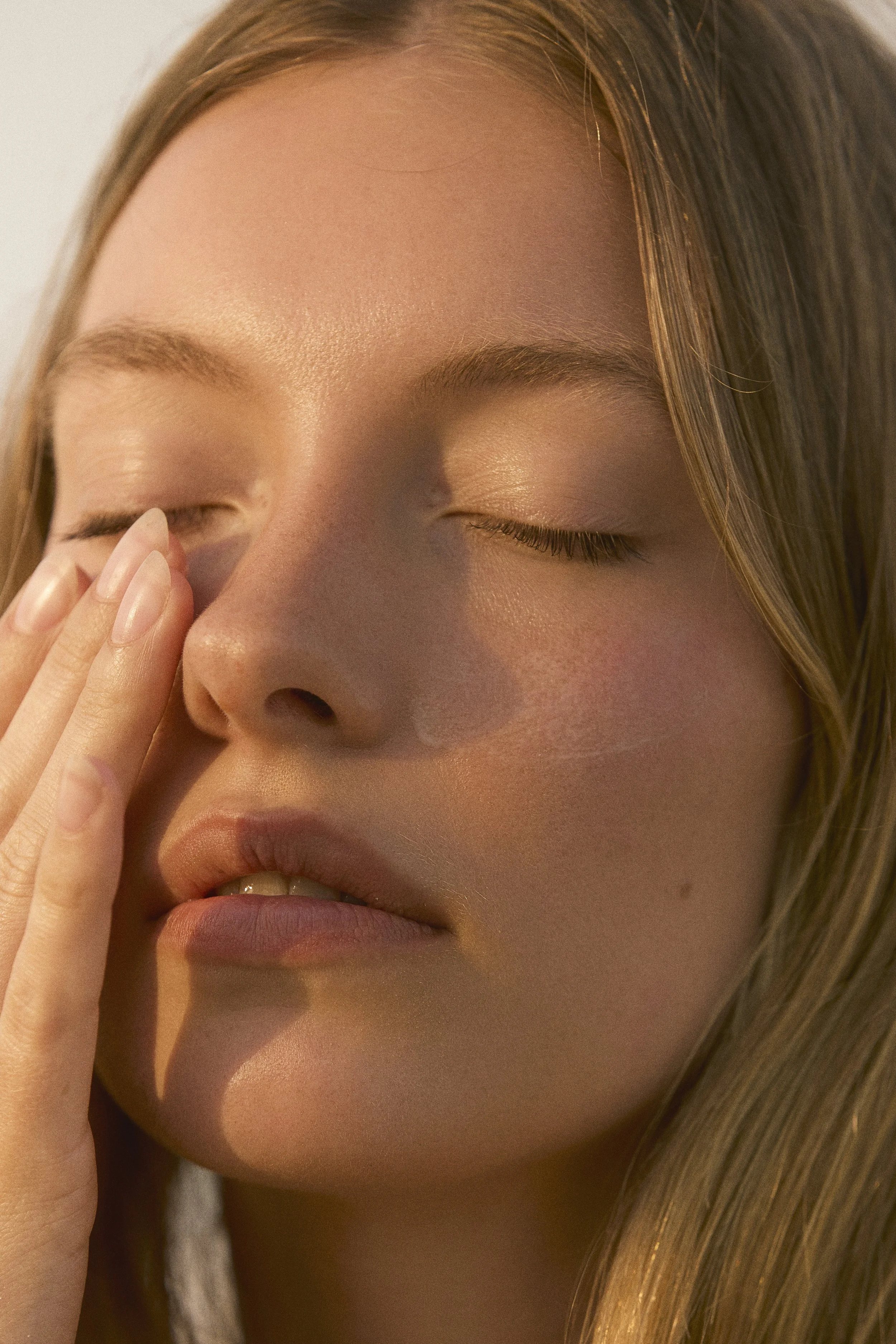 Spray tan artist blending custom color for flawless glow in Lower West Batavia, NY.