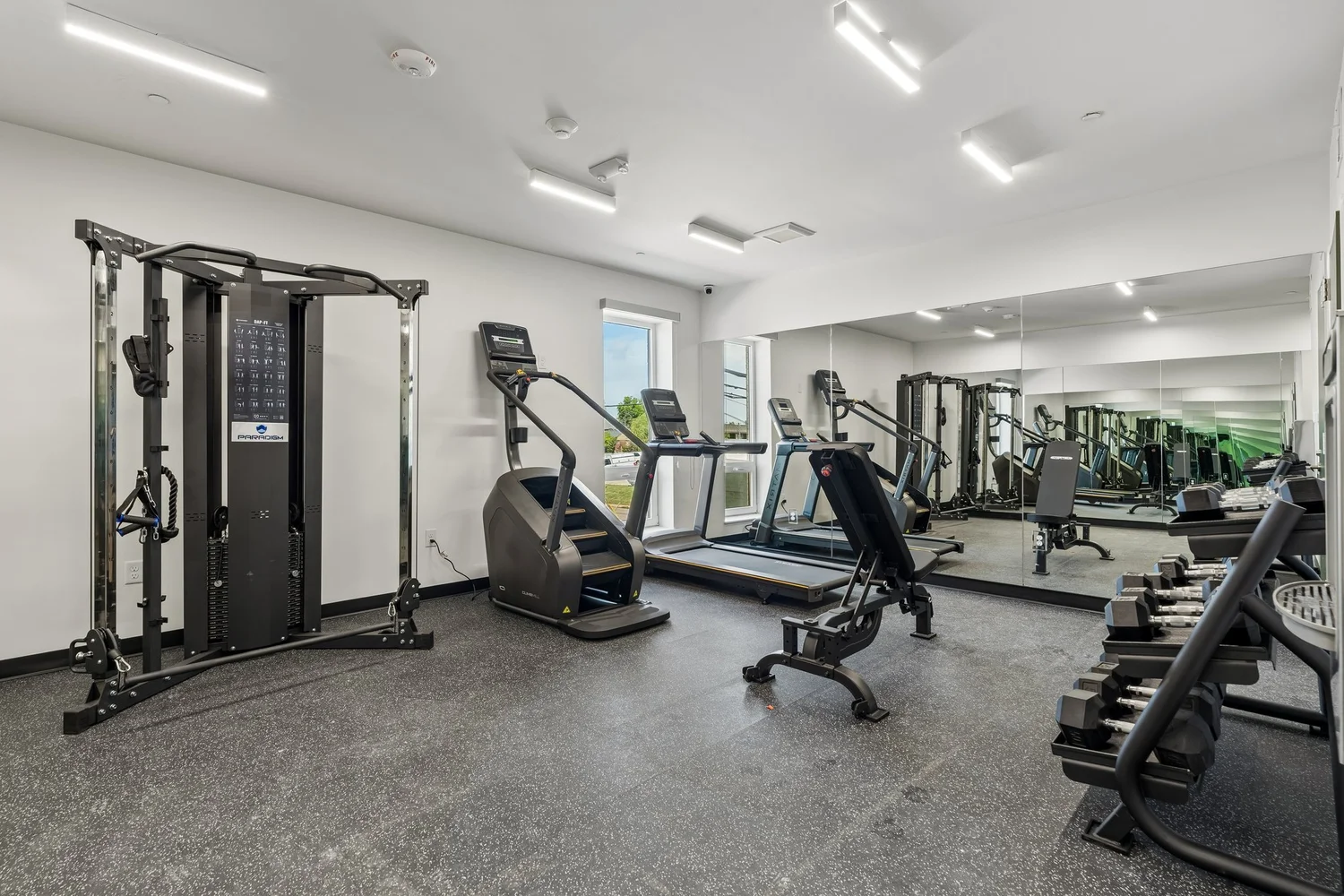 Community fitness center with a cable machine, treadmills and free weights