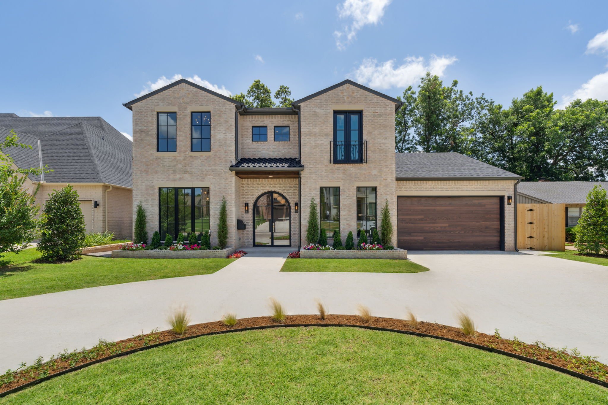 Twilight exterior of an Oklahoma City home, front lights on