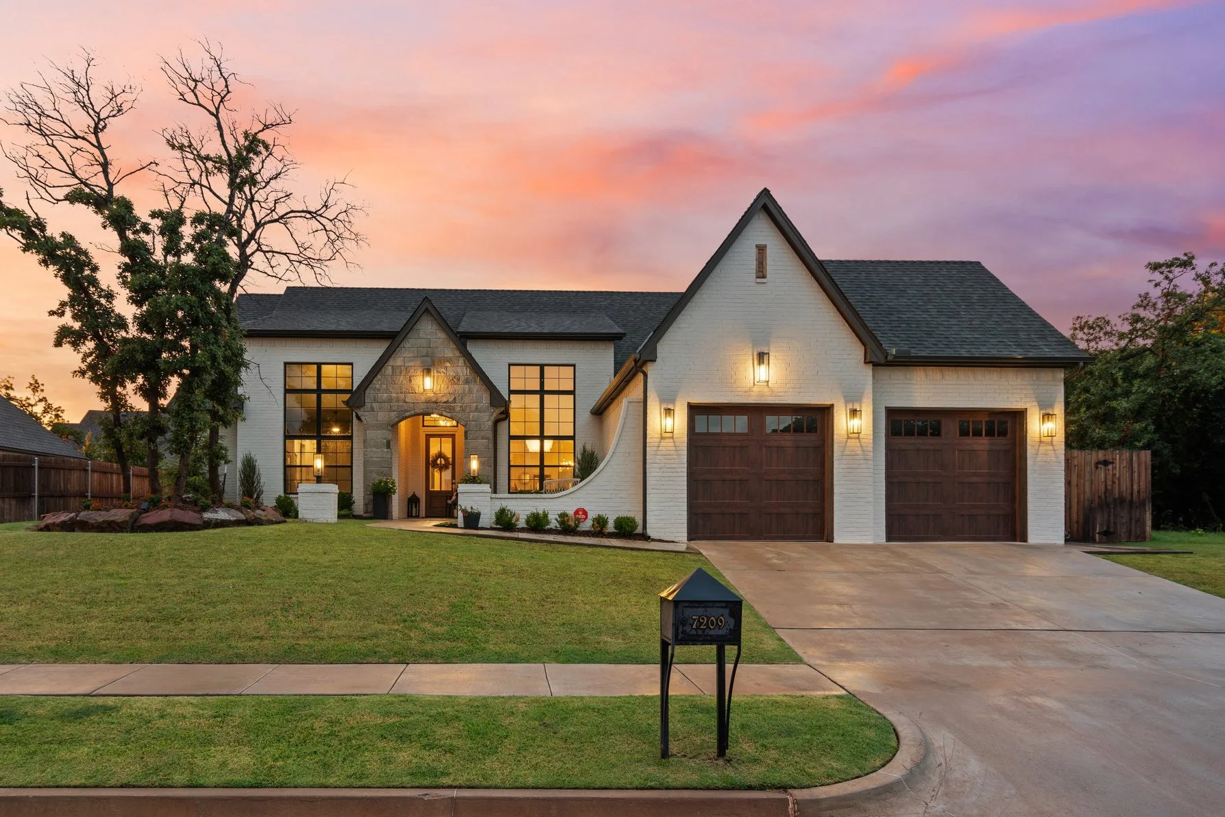 Twilight exterior of an Oklahoma home at sunset