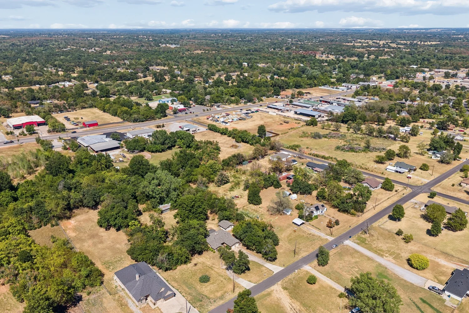 High aerial showing the property and the surrounding neighbourhood