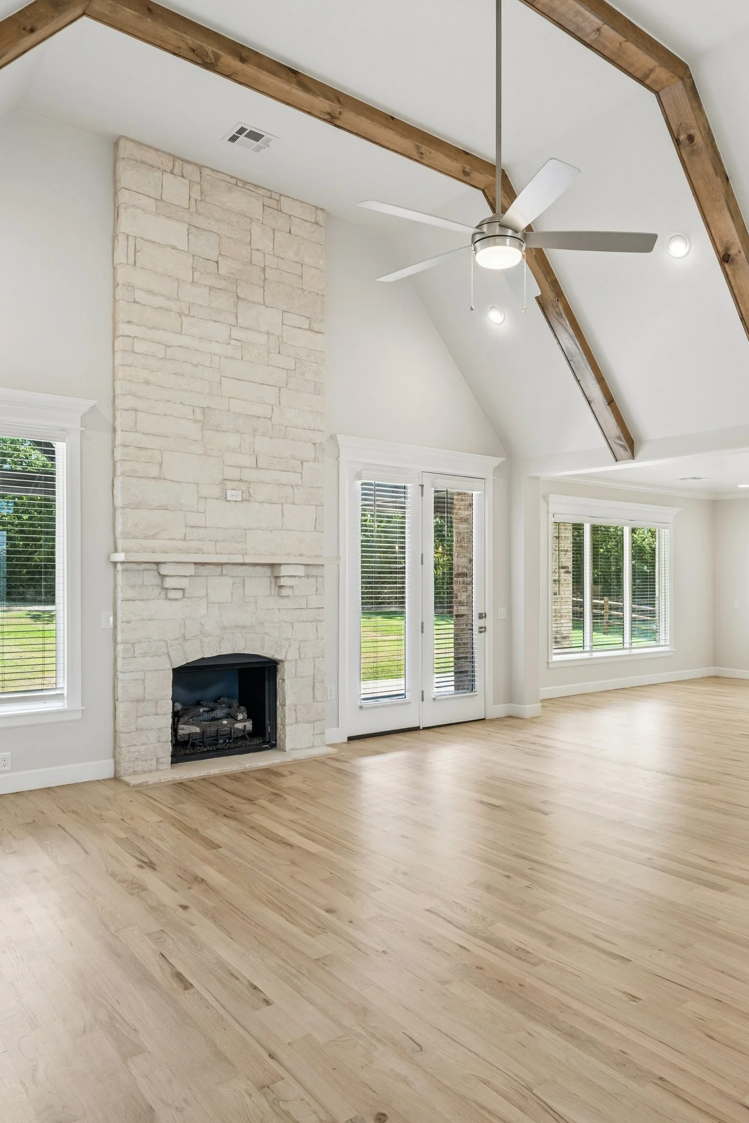 Living space in a new build, brick and stained beams true to life