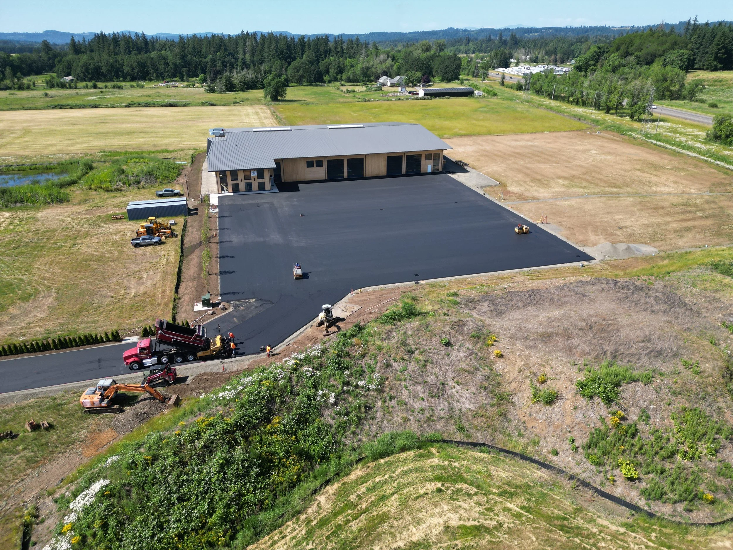 paving a new parking lot, asphalt paving, rolling asphalt parking lot