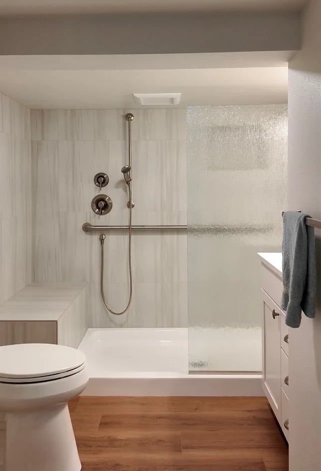 Custom designed bathroom remodel by Nordic home Solutions in Blackmans Lake -  Snohomish, WA . Featuring with a walk-in shower, dual showerheads, frosted glass shower door.