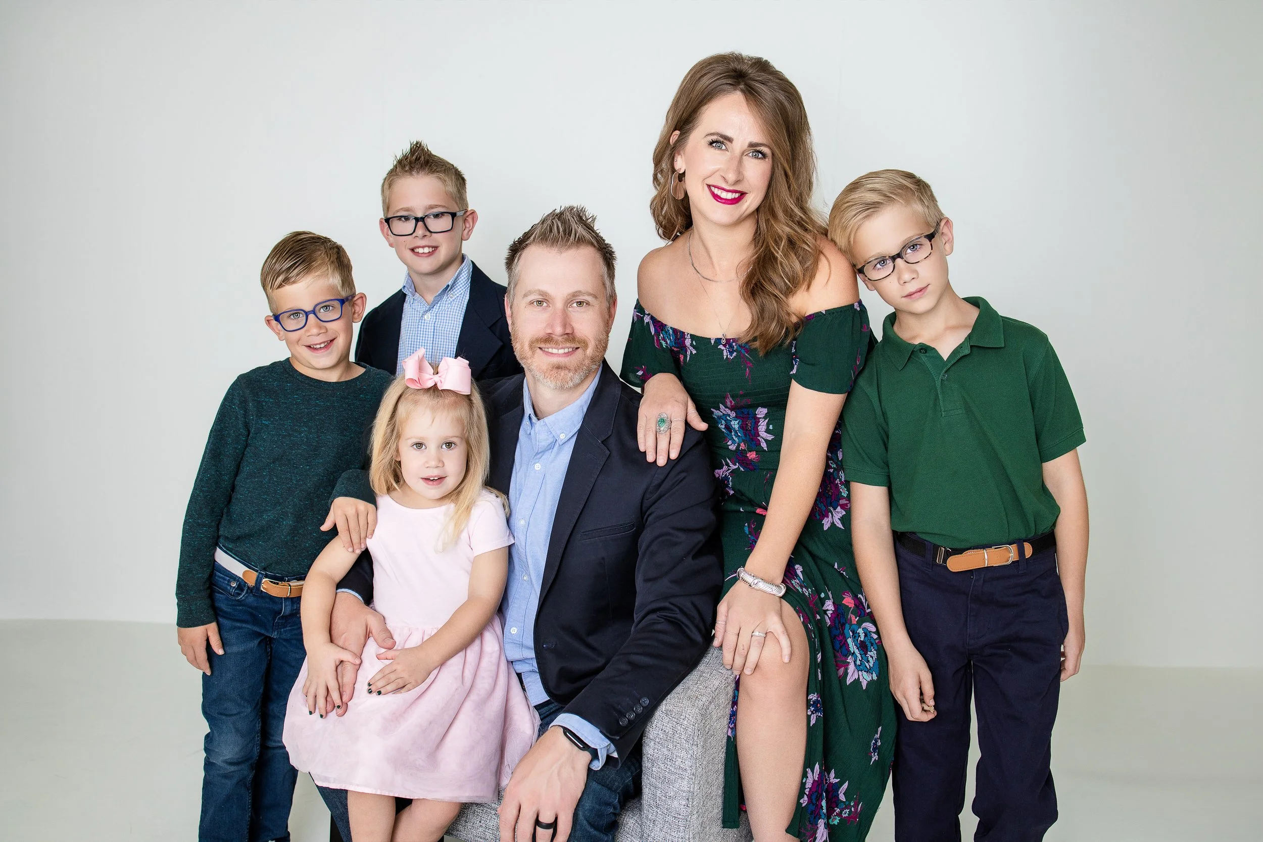 Studio family portrait of parents and their five children, photographed by Colorado Springs family photographer Charlotte Harloff. Fully guided and stress-free, this session captures connection and personality with timeless style.