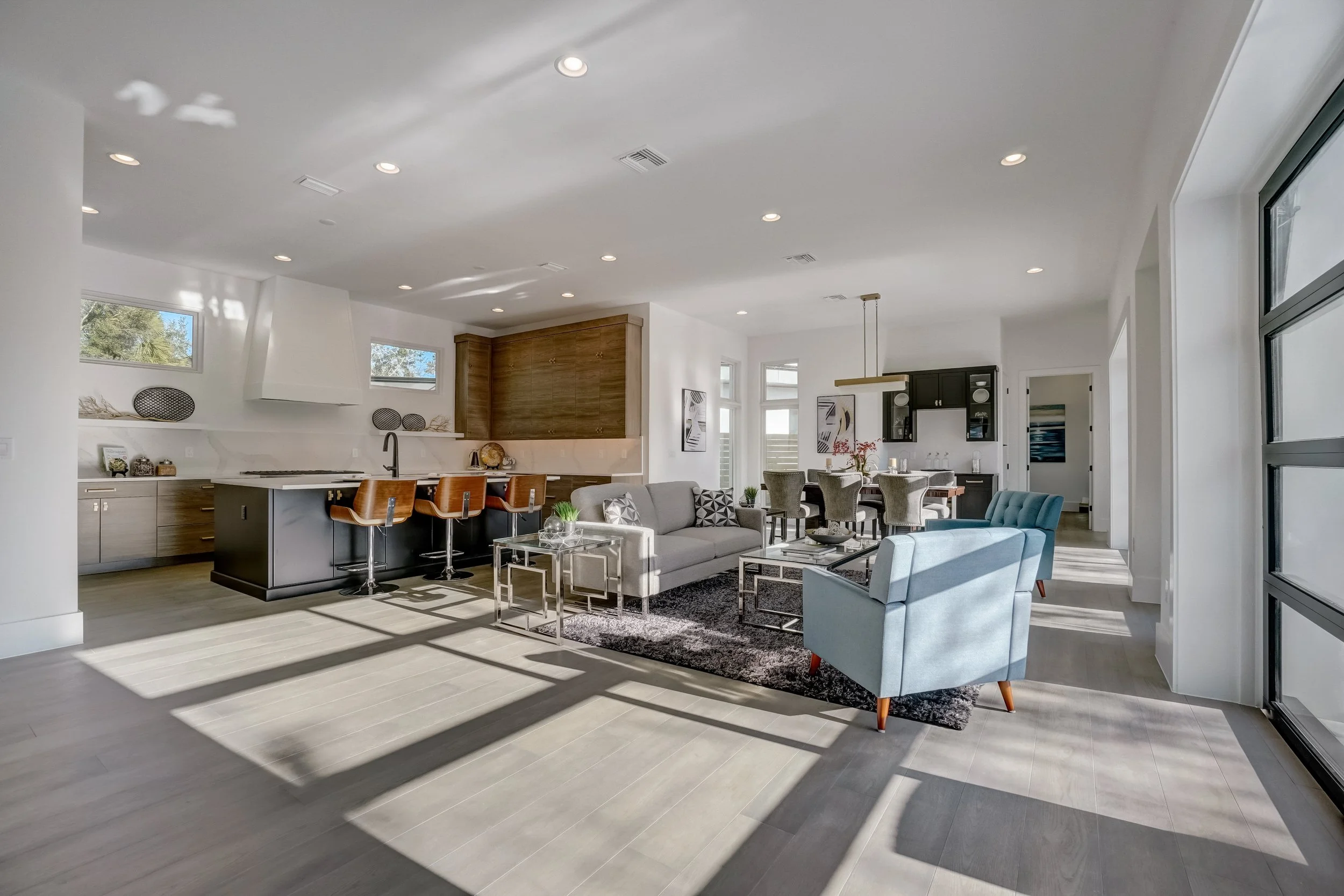 Open living space with wood flooring designed for Florida homes