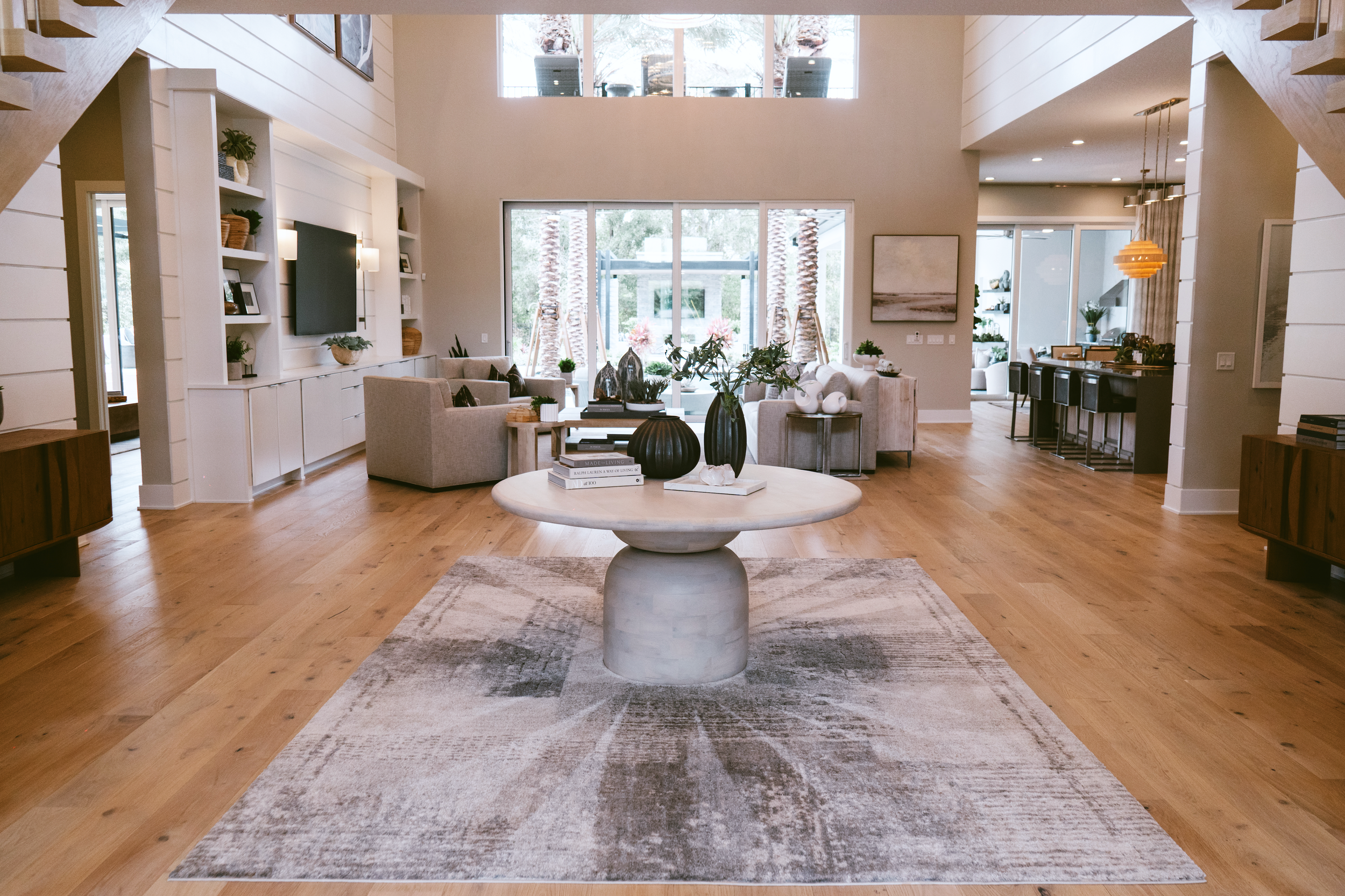 Residential living area with wide plank hardwood flooring