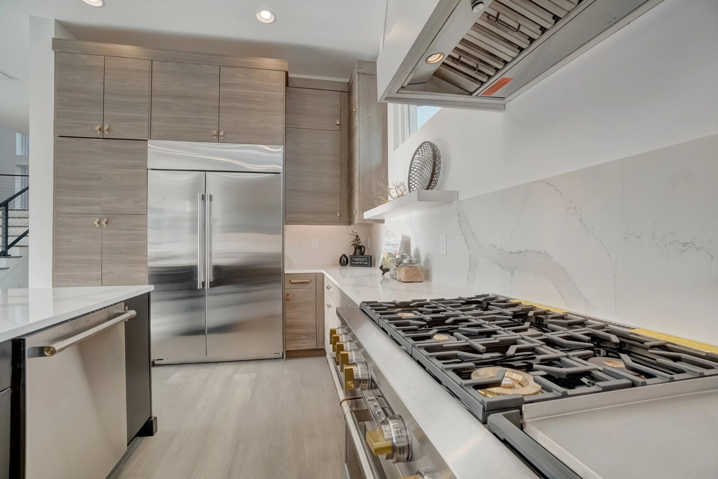 Kitchen renovation featuring durable flooring and clean-lined design