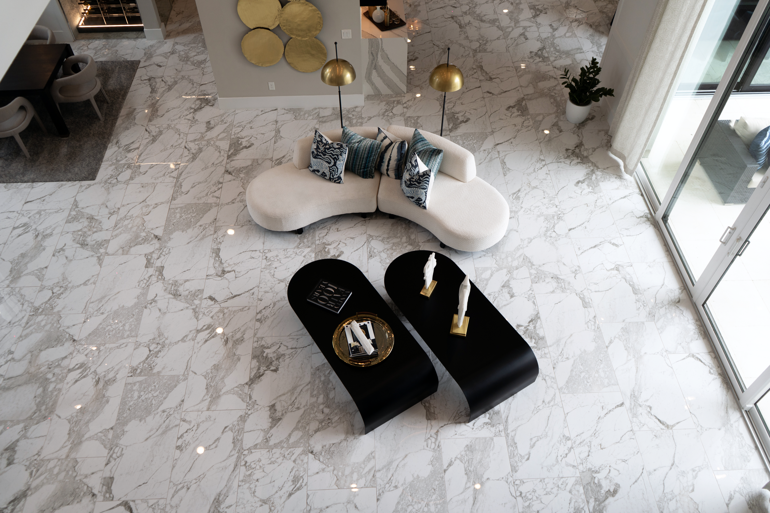 Bright living room showcasing marble flooring installation