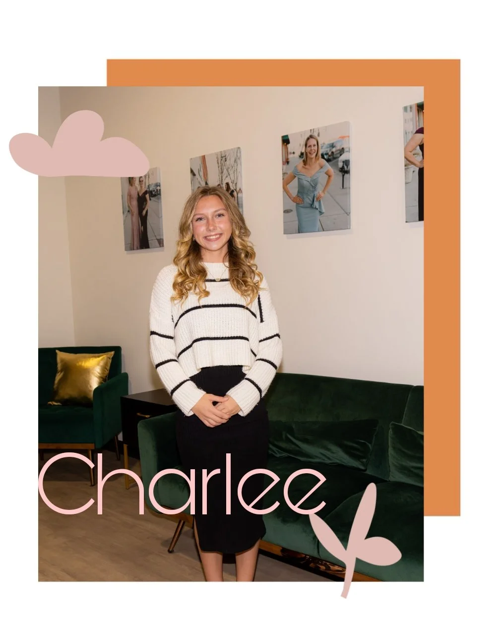 A young woman with blonde curly hair smiling, standing indoors in front of a white wall decorated with framed photographs. She is wearing a white sweater with black horizontal stripes and a black skirt. There is green furniture with yellow cushions behind her and the name 'Charlee' written in pink with a leaf graphic at the bottom left corner.