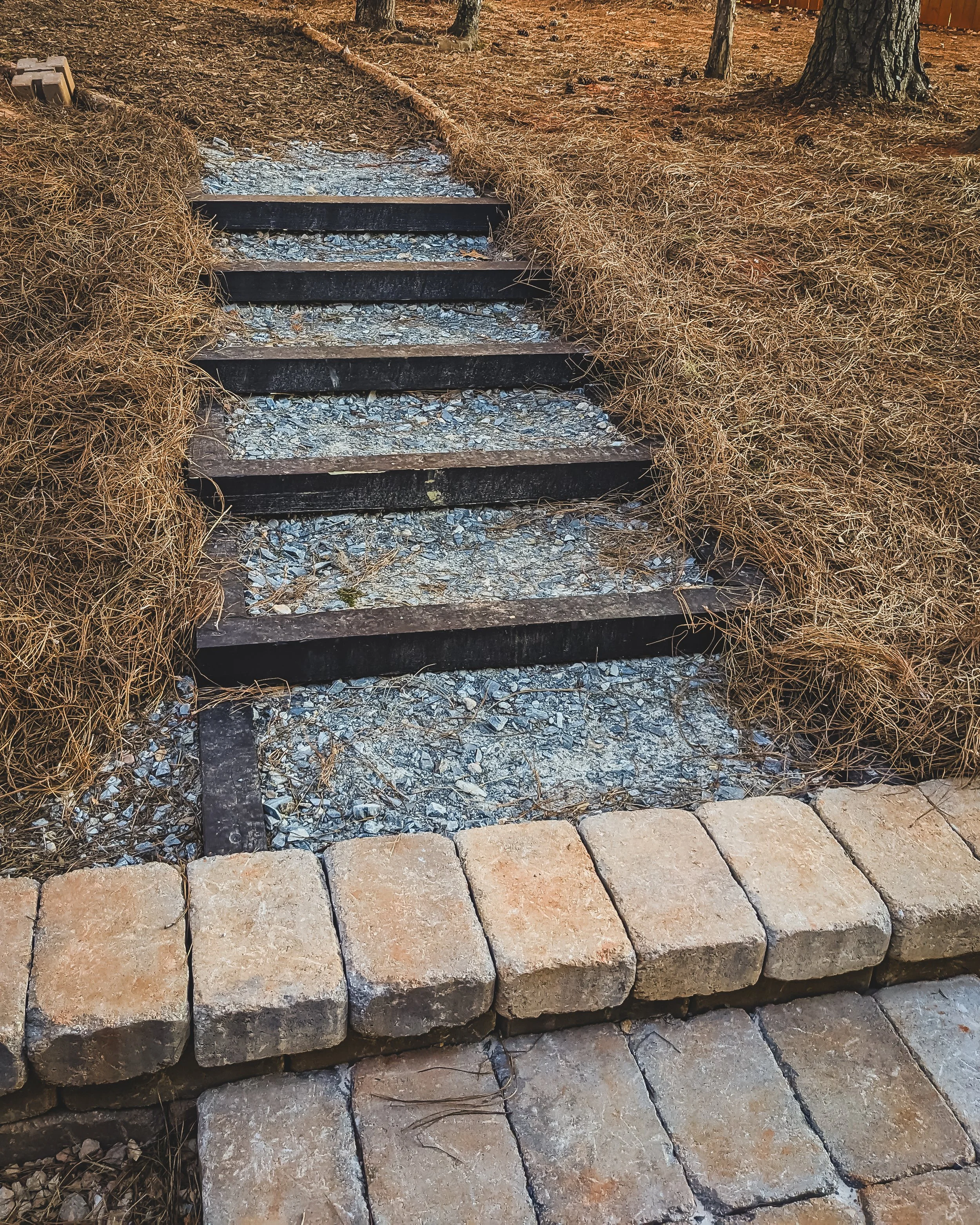 Hillside graded, added new steps with timbers and gravel