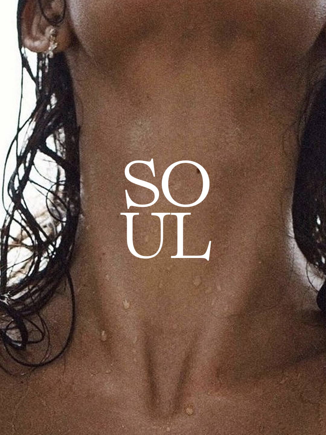 Close-up of a woman's chest and stomach with wet hair and water droplets, with the words 'SO UL' overlaid in the center.