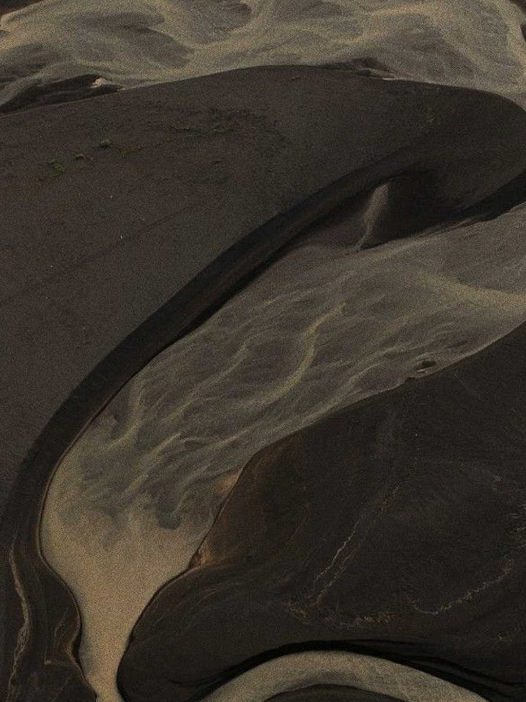 Close-up image of a polished marble surface with gray and black swirls.
