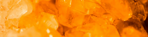 Close-up of orange gemstones or crystals