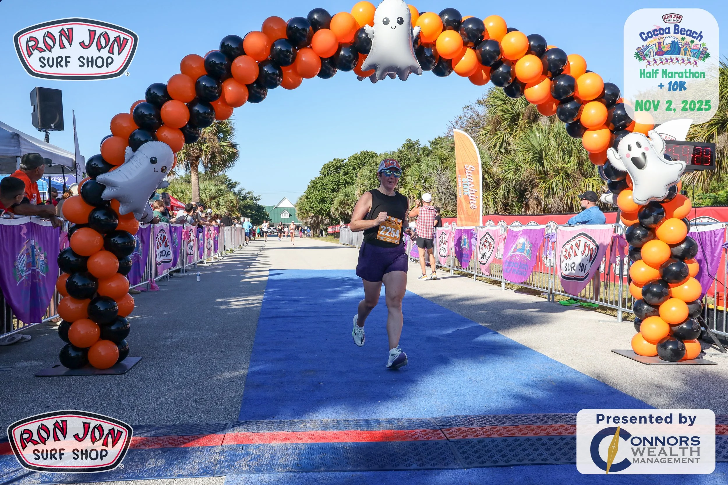 Coach crossing finish line