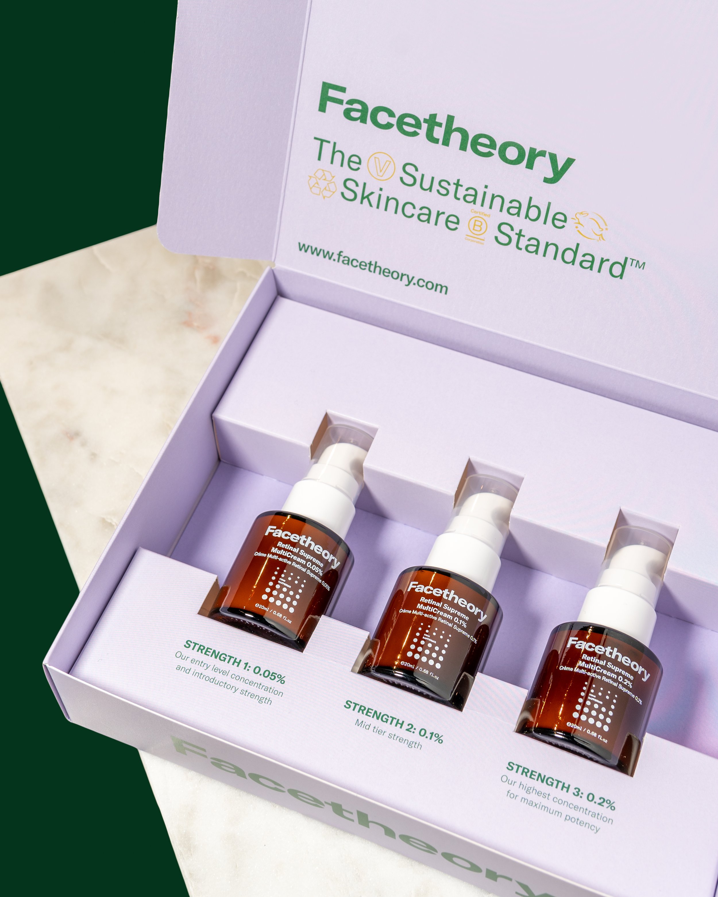 Open box of skincare product samples from Facetheory, showing three small bottles labeled with different strengths of a retinal cream: 0.05%, 0.1%, and 0.2%, with corresponding descriptions of strength levels.