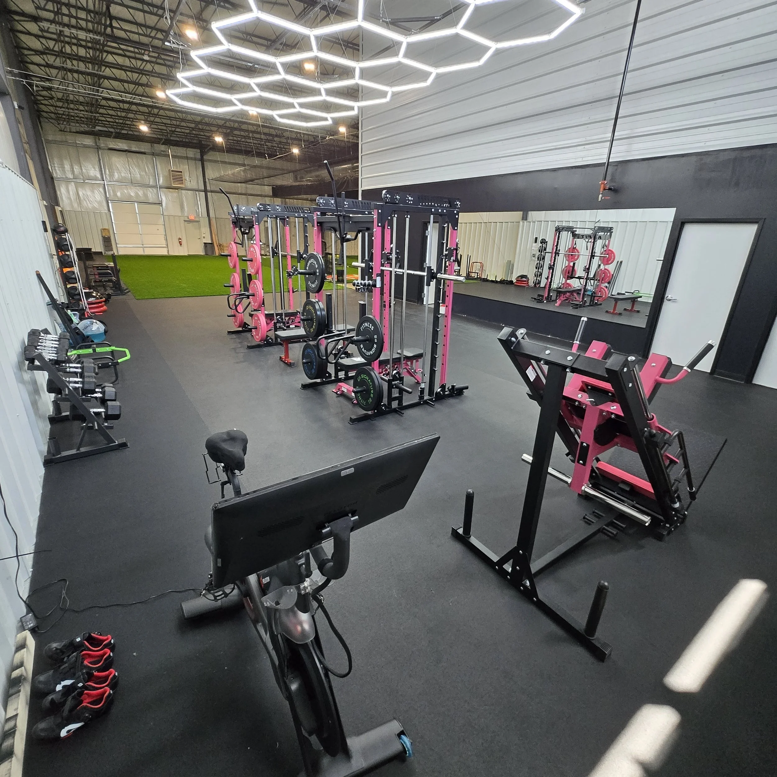 As a member, you get access to our full gym.  Included are 2 custom pink RitFit racks, leg press, Peloton and dumbbells.