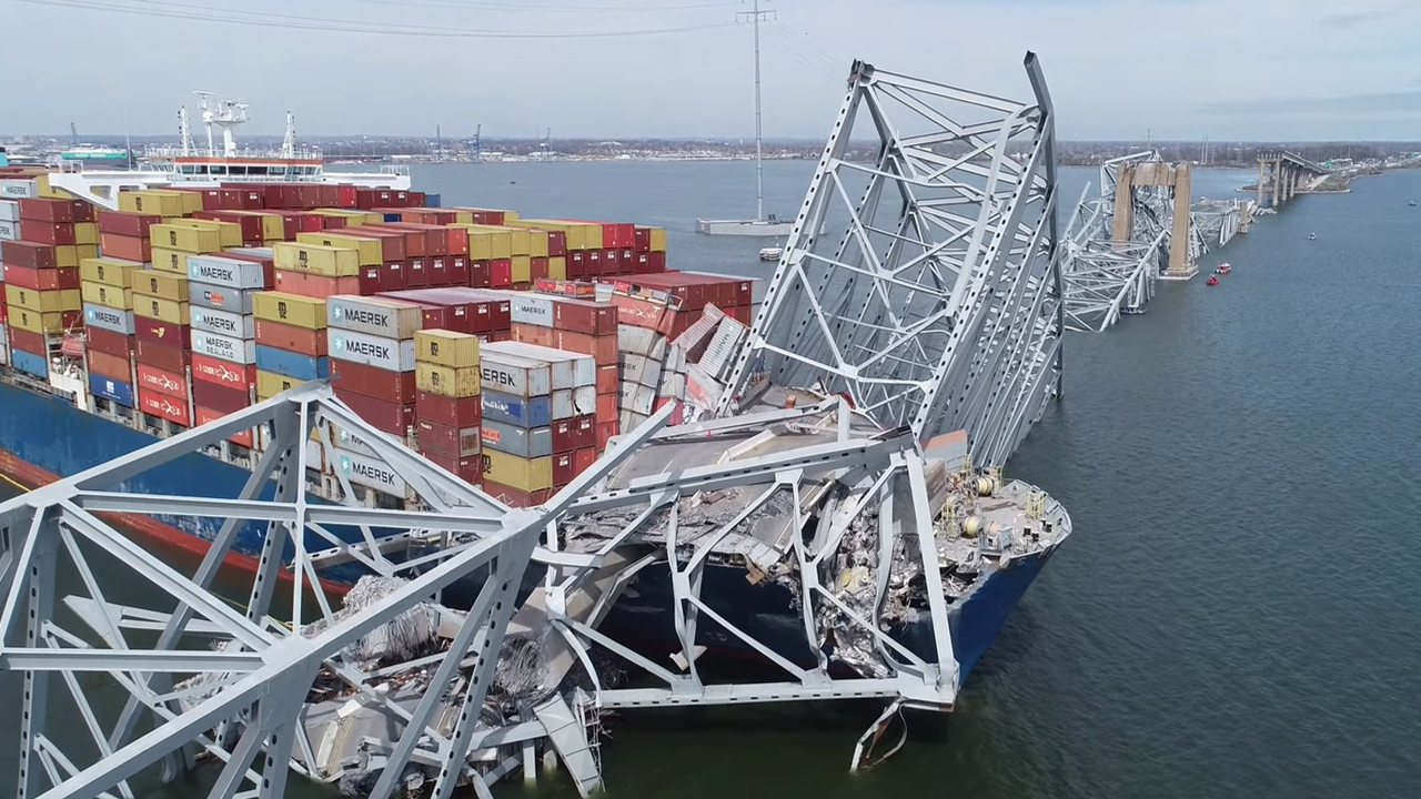 A large container ship has collided with a bridge, causing structural damage and collapse of parts of the bridge into the water. SpanSight can help mitigate these kinds of incidents.