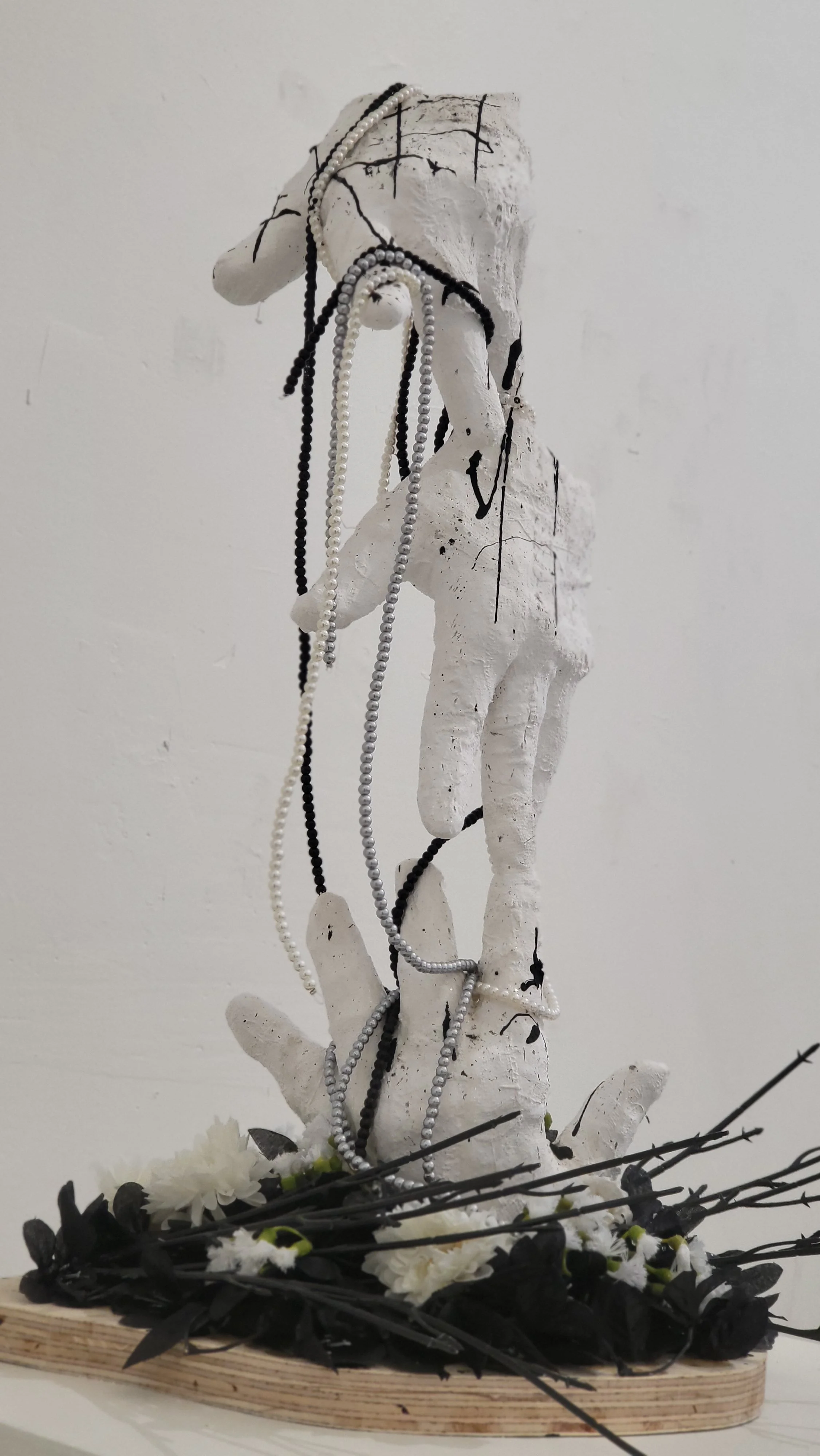 Hands of desire; Plaster sculpture (Side 1)