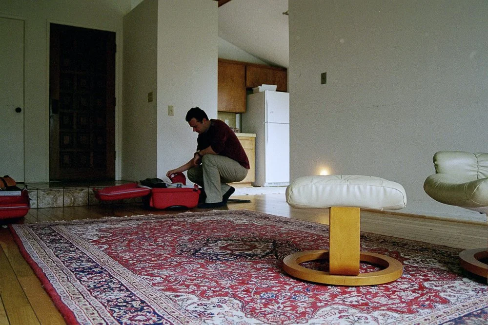 Roy Kerckhoffs unpacking his suitcases after arrival in his new Del Mar apartment