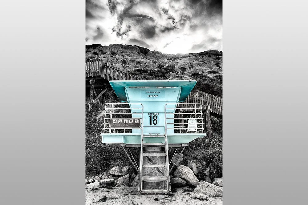 blue lifeguard tower 18 with black and white background of bluffs and stairs in encinitas california.jpg