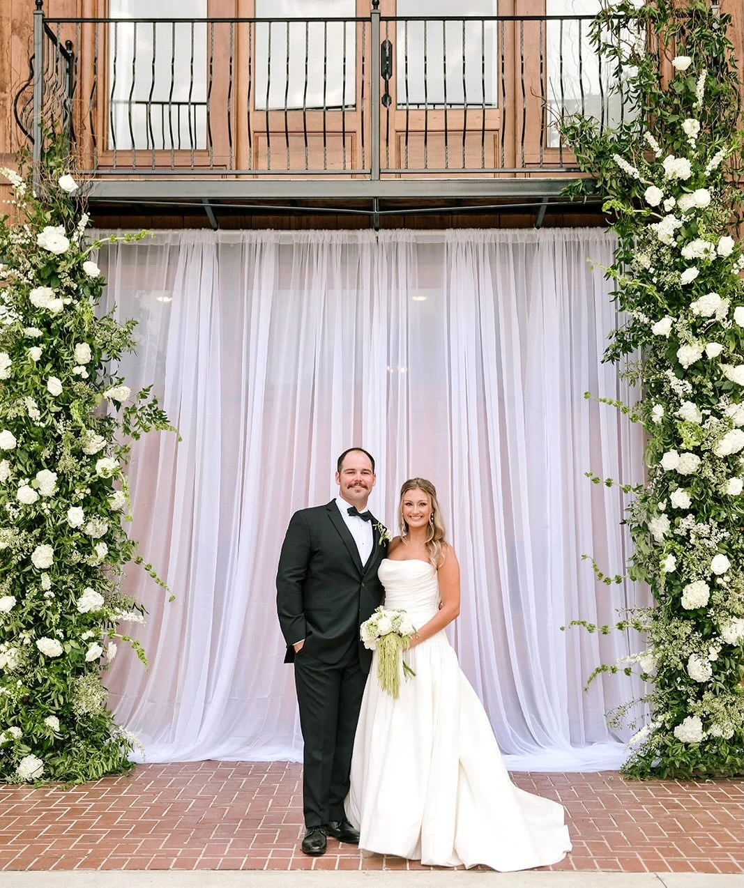When Mary Hannah and her mom first shared their vision with me, they dreamed of transforming a barn venue into something that felt elevated, refined, and romantic while still honoring the warmth of the space itself. Through layers of soft draping, lu