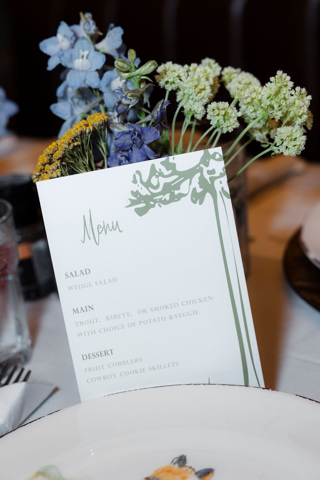 : Western wedding menu card and floral table décor in Wyoming. 