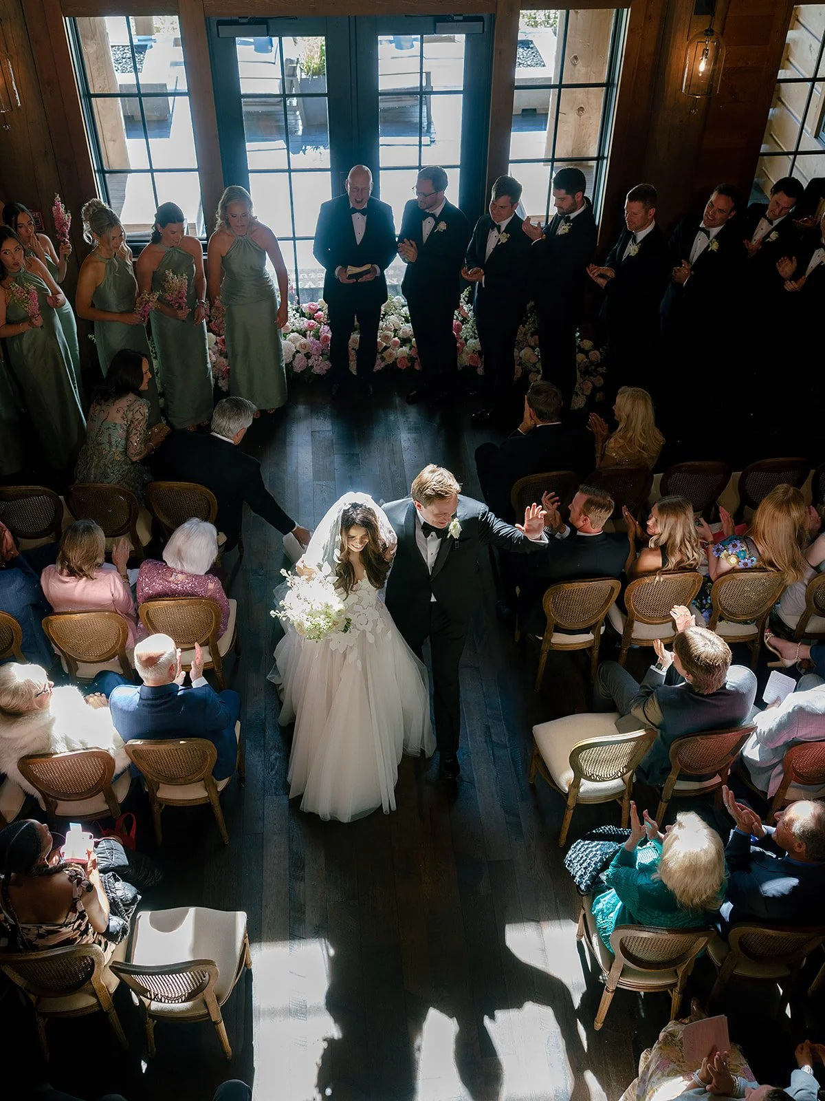 Snake River Sporting Club wedding ceremony in the clubhouse foyer with string quartet and French doors
