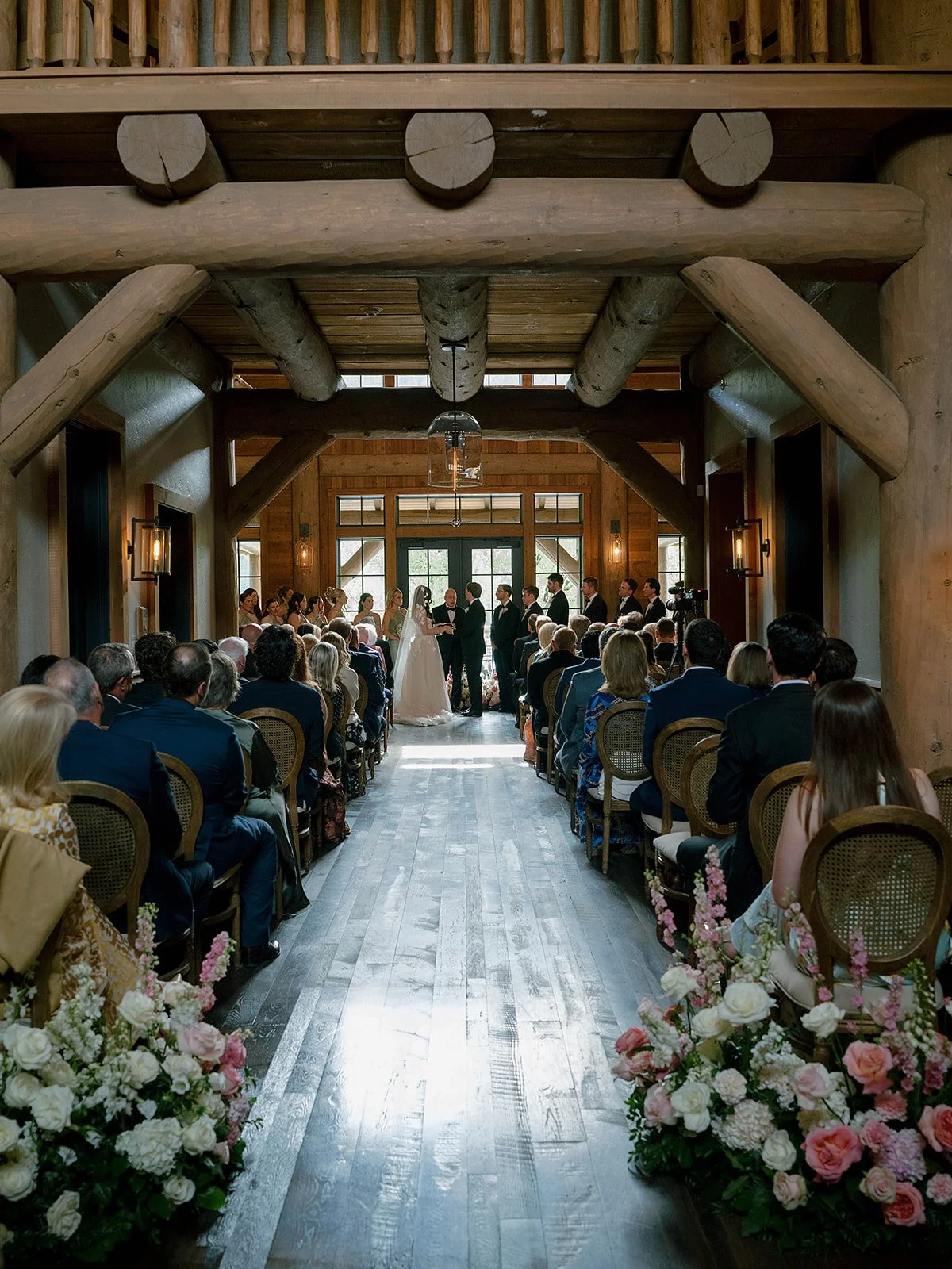 Snake River Sporting Club wedding ceremony in the clubhouse foyer with string quartet and French doors