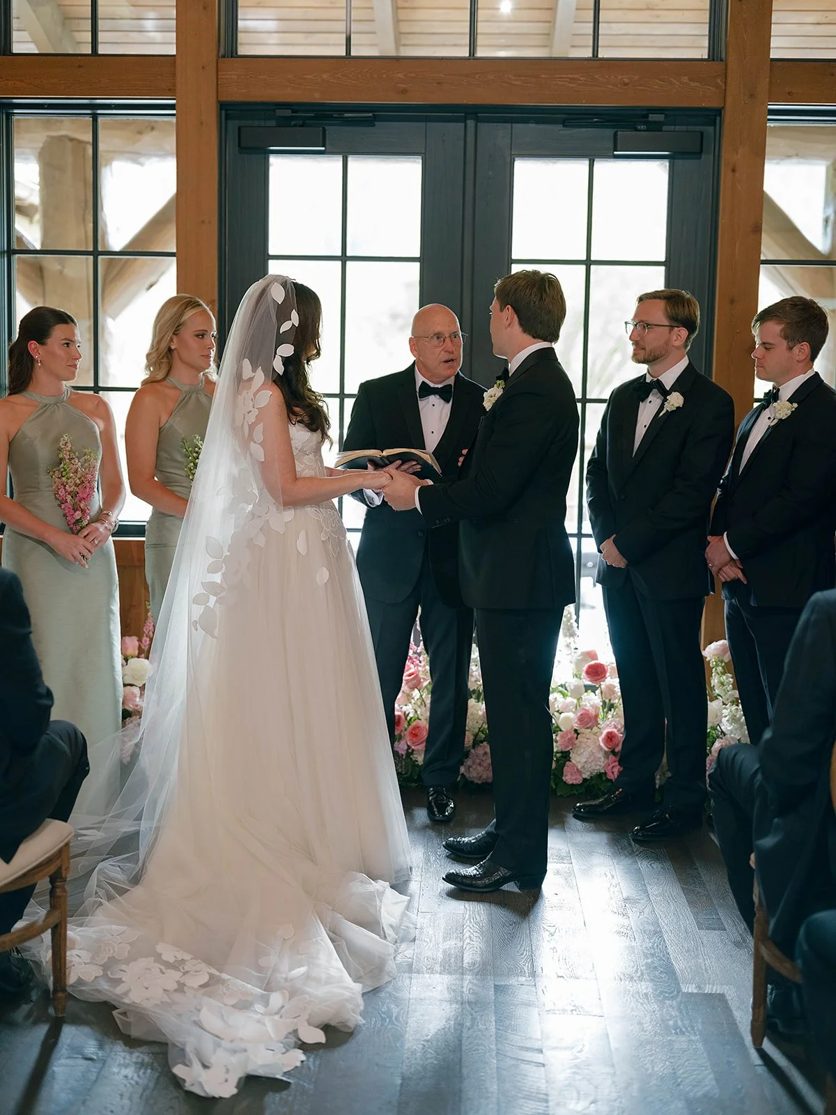 Snake River Sporting Club wedding ceremony in the clubhouse foyer with string quartet and French doors