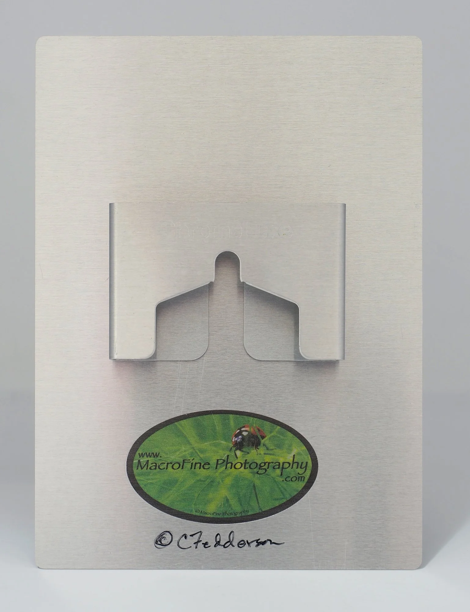 aluminum hanger on back of piece