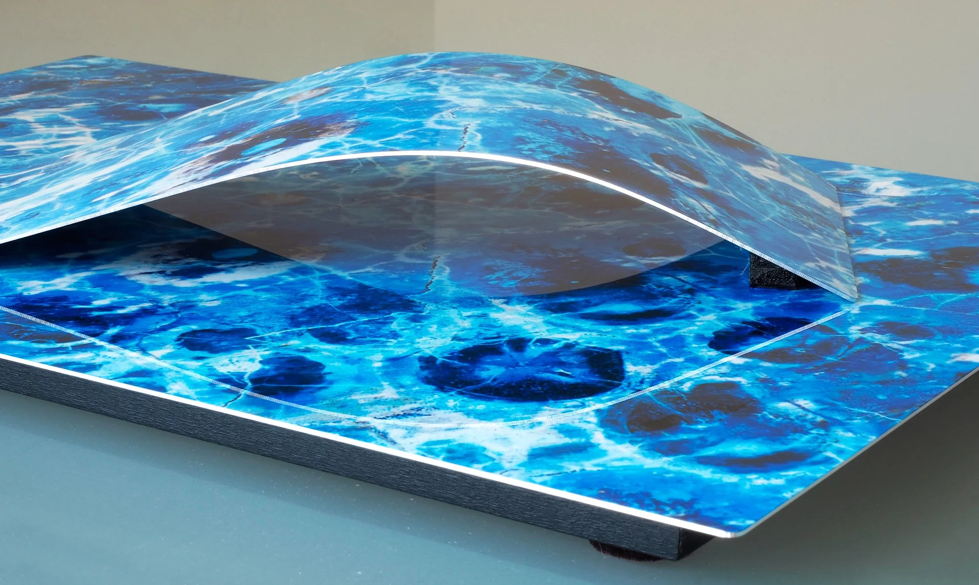 corner view of image of a color-altered slice of birds-eye rhyolite