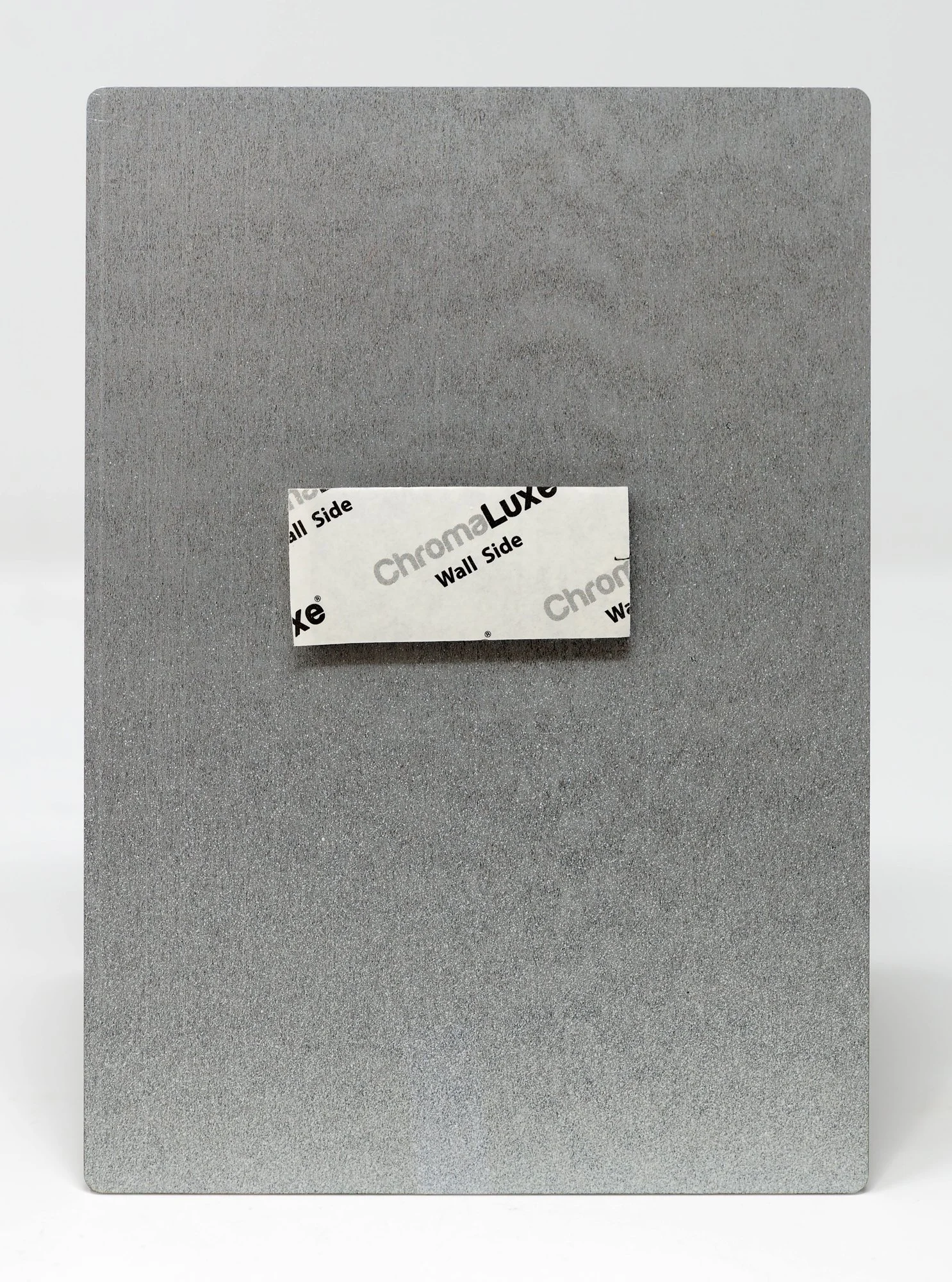 back of aluminum showing sticky pad hanger