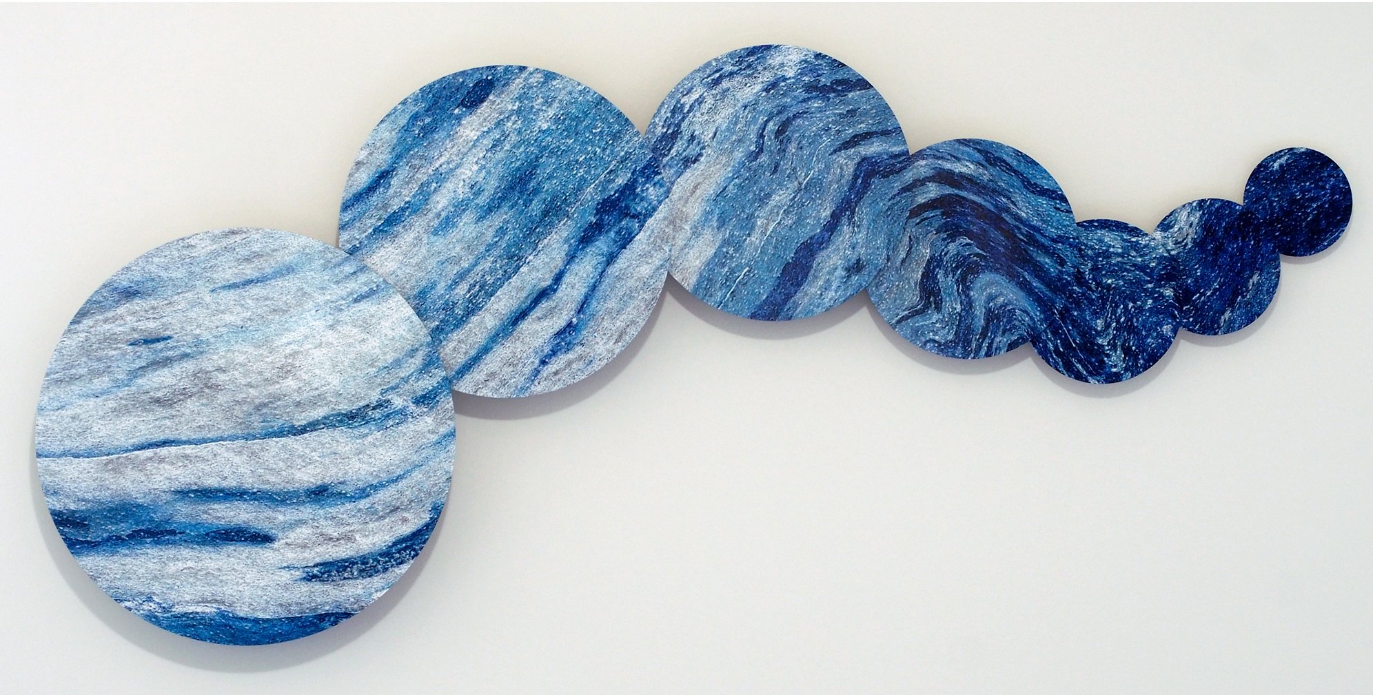 close-up of sublimated circles in a drift format showing color-altered tree trunk