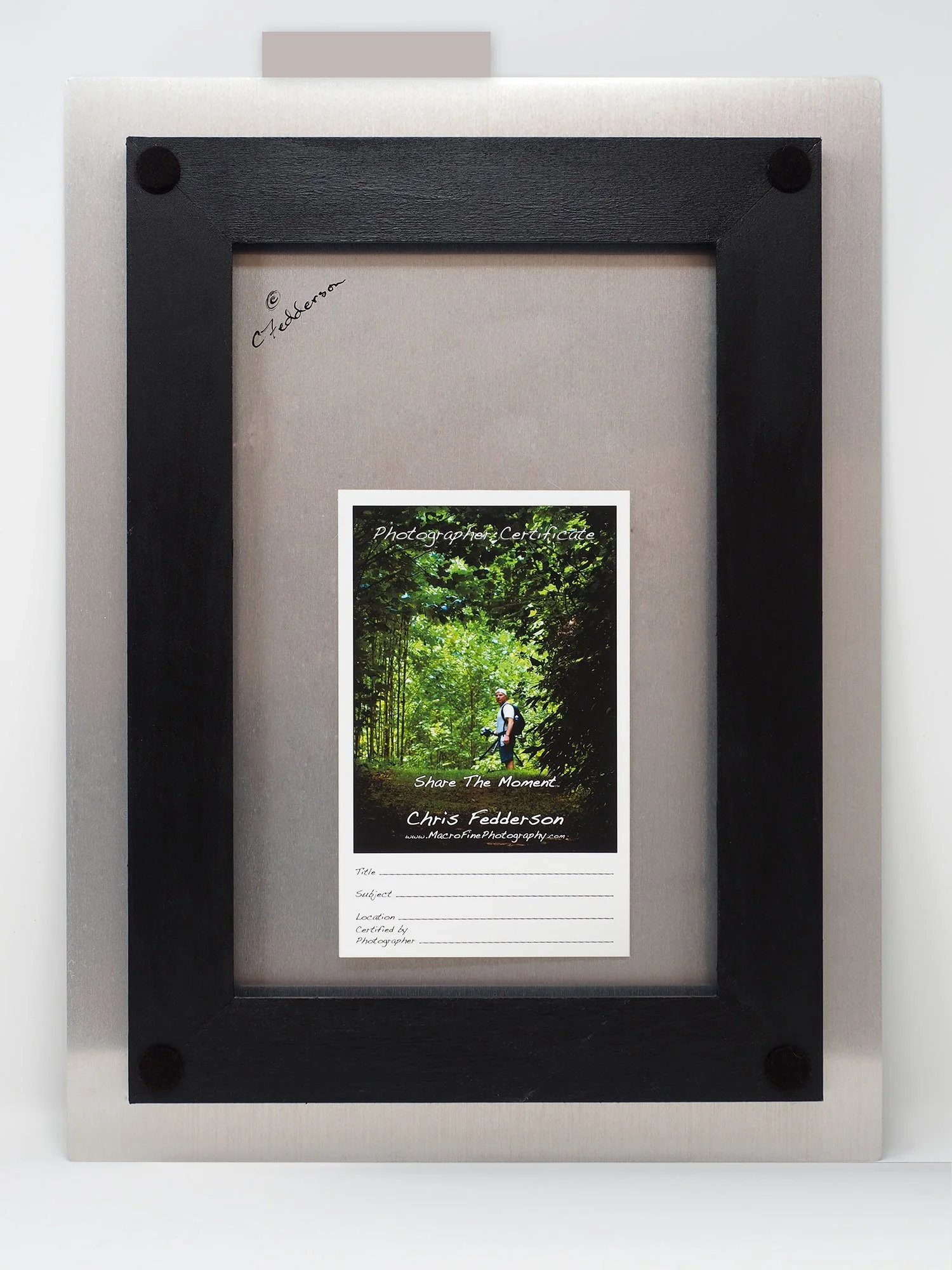 back of aluminum showing frame used for hanging