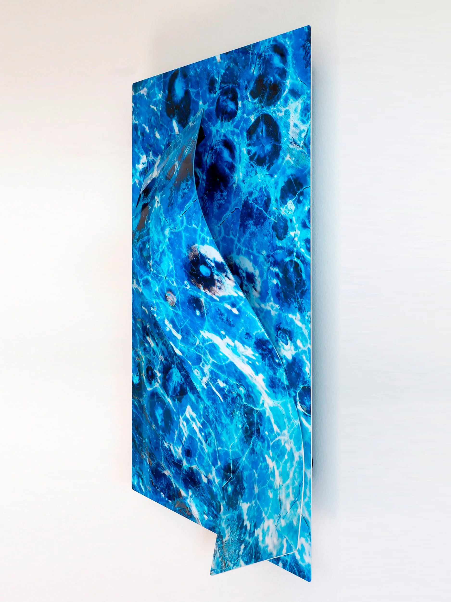 side view of image of a color-altered slice of birds-eye rhyolite