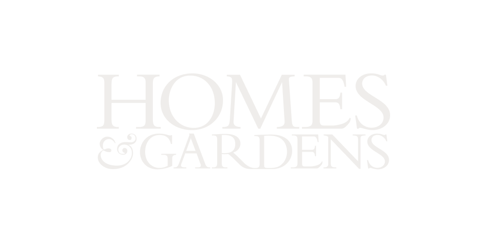 Logo for Homes & Gardens with black background and white text.