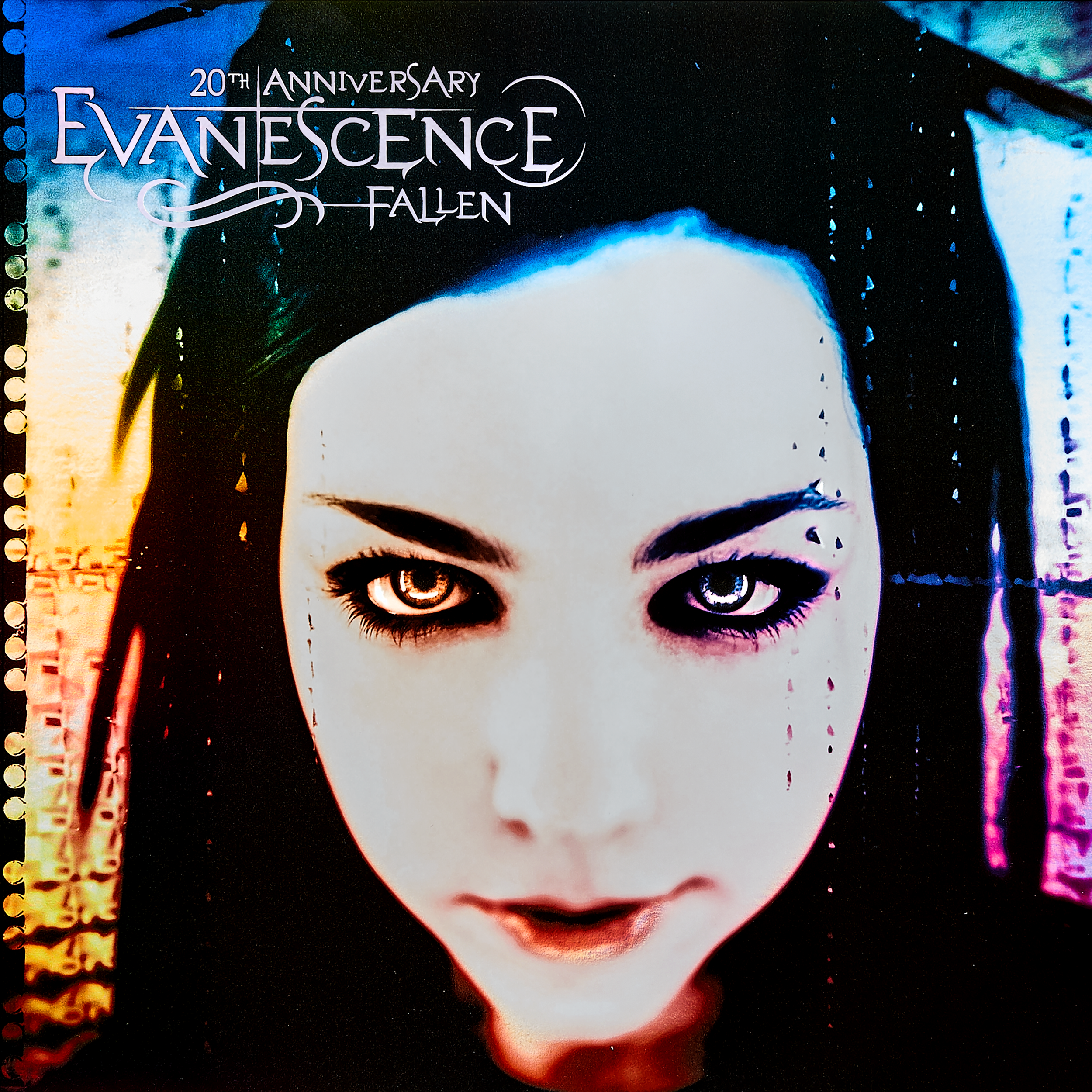 Album cover for Evanescence's 20th anniversary of 'Fallen,' featuring a close-up of a woman with pale skin, dark hair, and striking eye makeup, looking directly at the camera.