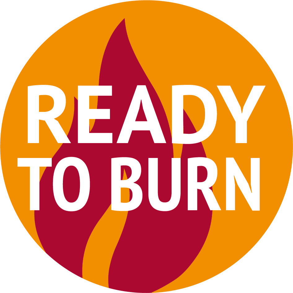 A circular sign with an orange background, a red flame graphic in the center, and white text that reads "READY TO BURN".