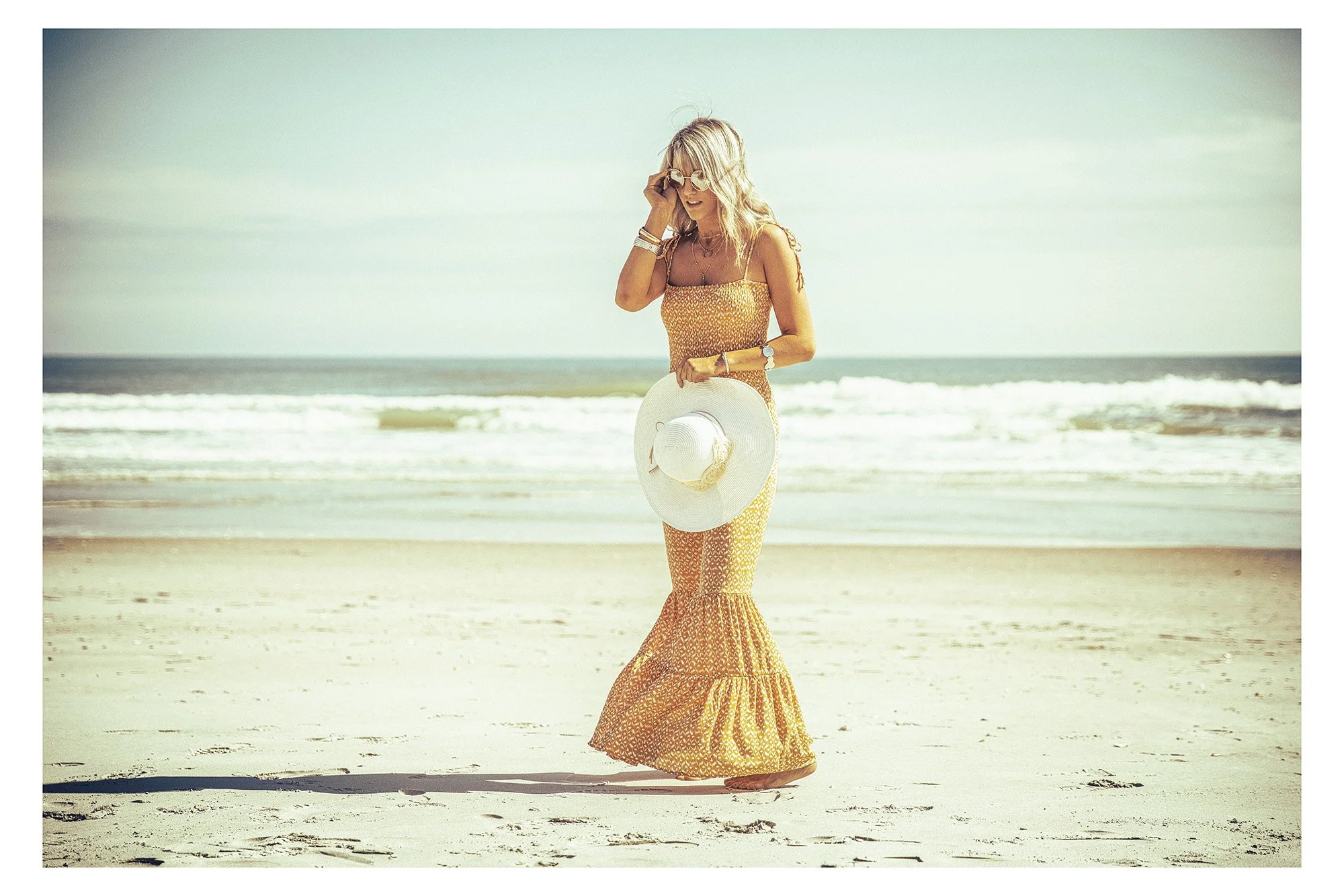 retro vintage image of woman on a beach in 70s style fashion