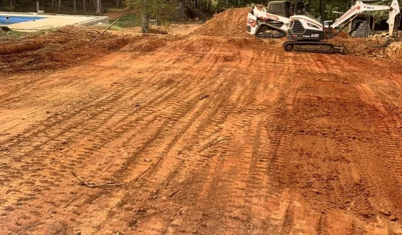 Land grading and leveling project in McMinnville, TN — preparing the soil for stable building foundations.