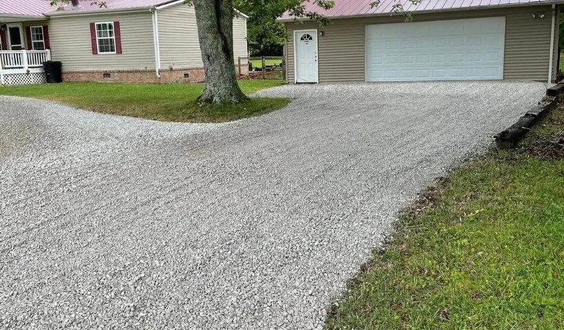 Residential gravel driveway with clean stone finish and garage access in McMinnville, TN