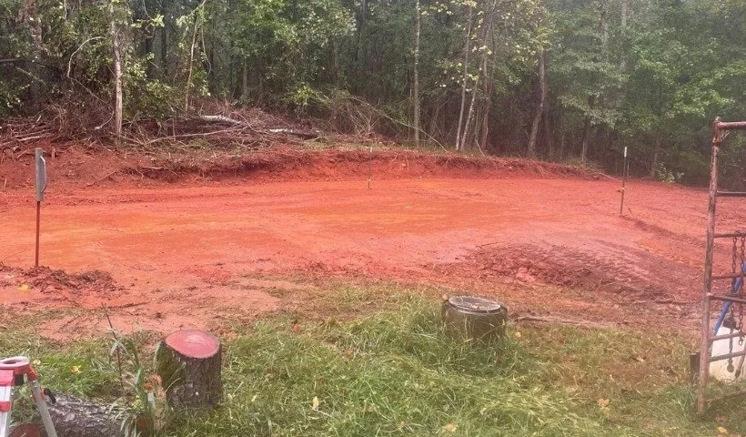 Land grading and leveling for a 28x35 building pad with cleared trees in Middle Tennessee